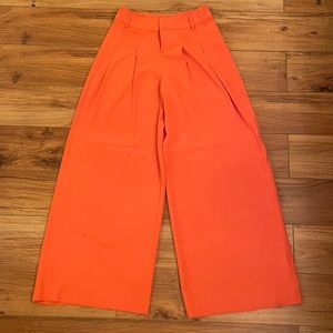 Alice and Olivia orange high waisted, wide leg pants. Size 8.